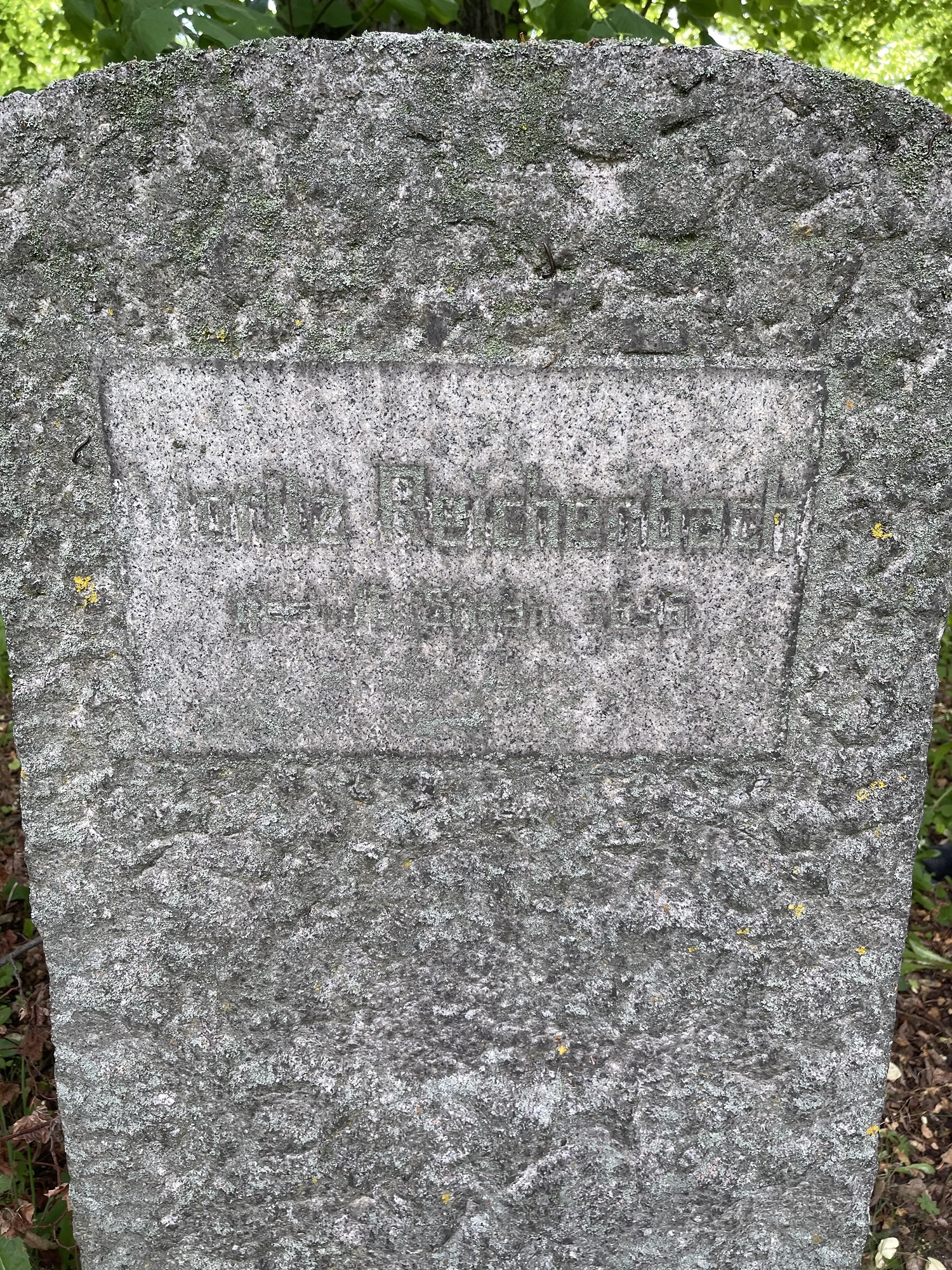 Weathered German face of Salomon Gustav Reichenbach’s gravestone in the Jewish cemetery at Halberstadt