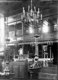 Historic black-and-white interior view of the Halberstadt synagogue with its Baroque Torah ark and octagonal bimah