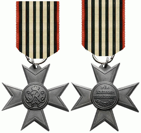 Obverse and reverse of a Prussian Merit Cross for War Aid shown side by side