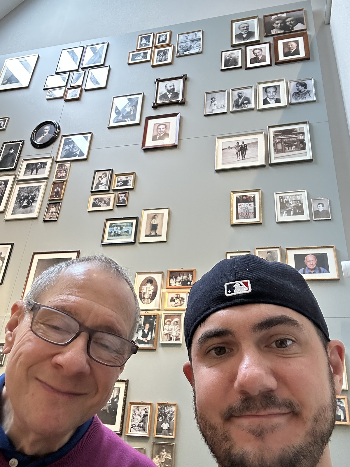 Paul J. Reichenbach and his son Rabbi Daniel Dolph Reichenbach inside the Berend Lehmann Museum in Halberstadt beneath a wall of historic portraits