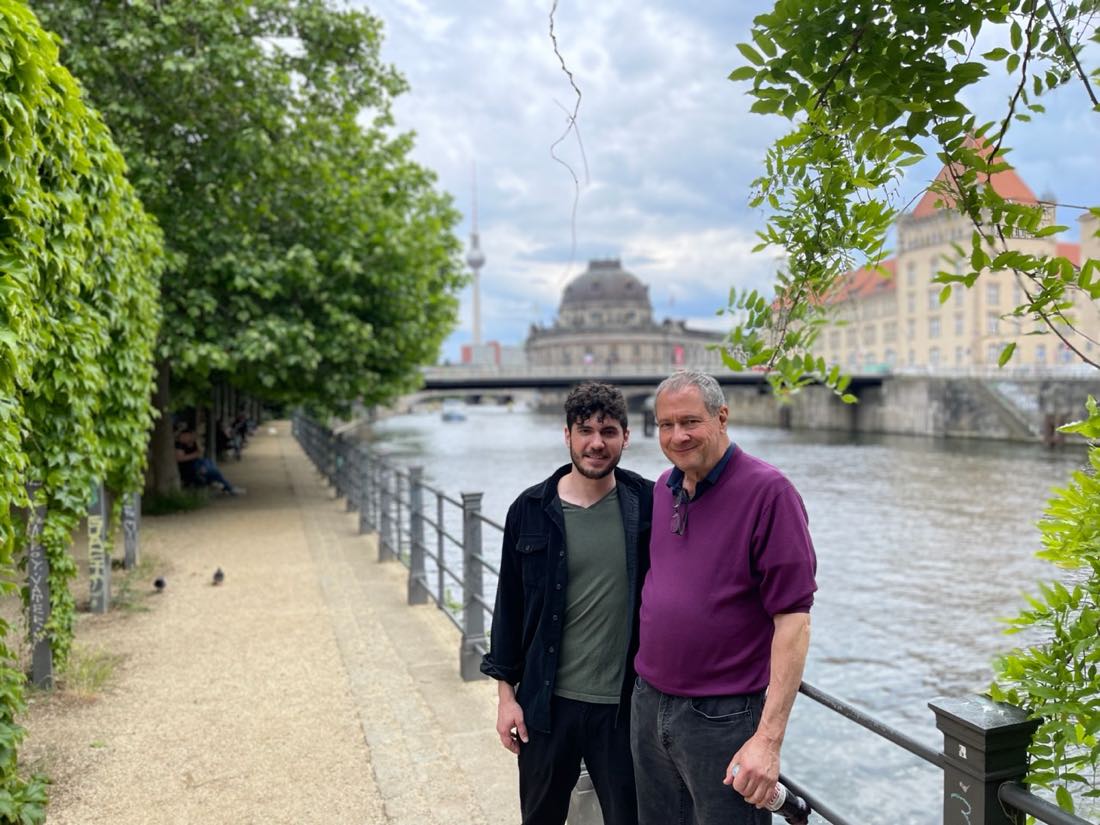 Rabbi Daniel Dolph Reichenbach and his father Paul J. Reichenbach standing together beside the Spree in Berlin