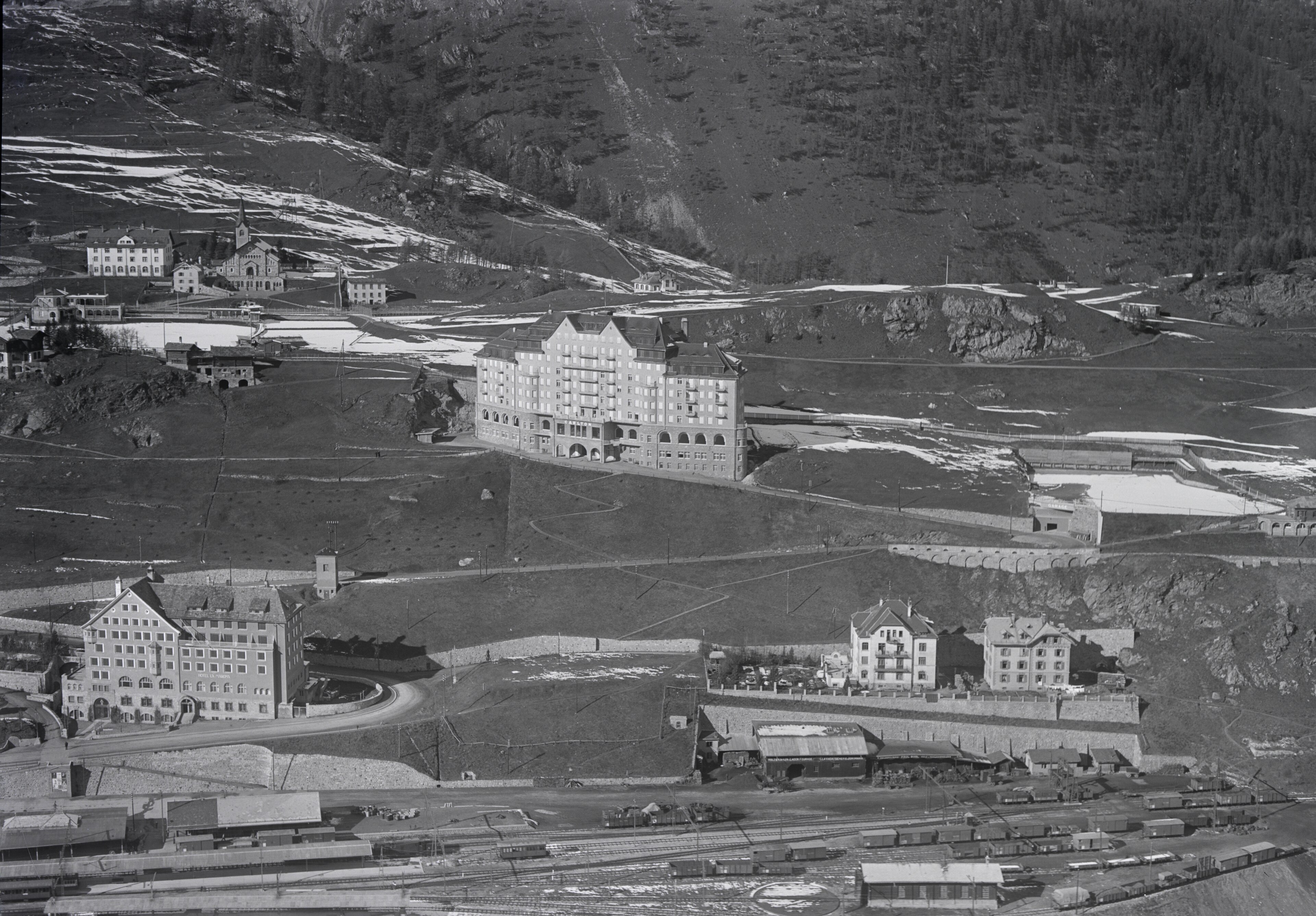 Historical aerial photograph of the Carlton Hotel overlooking St. Moritz and its railway lines