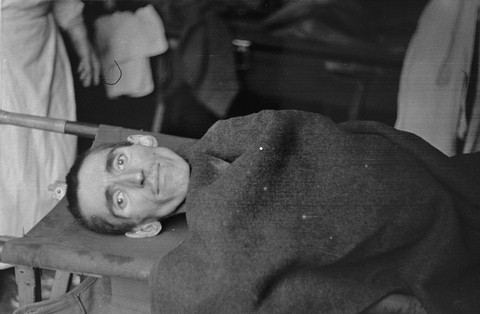 Figure 16. Figure 16. A survivor of Langenstein-Zwieberge evacuated by stretcher to hospital, April 1945. Photographed by Dr Bernar...